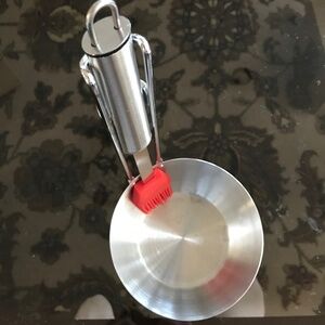 A barbecue sauce dispenser